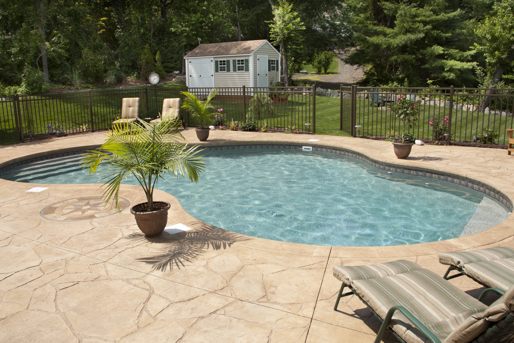 Residential swimming pool with clean blue water.