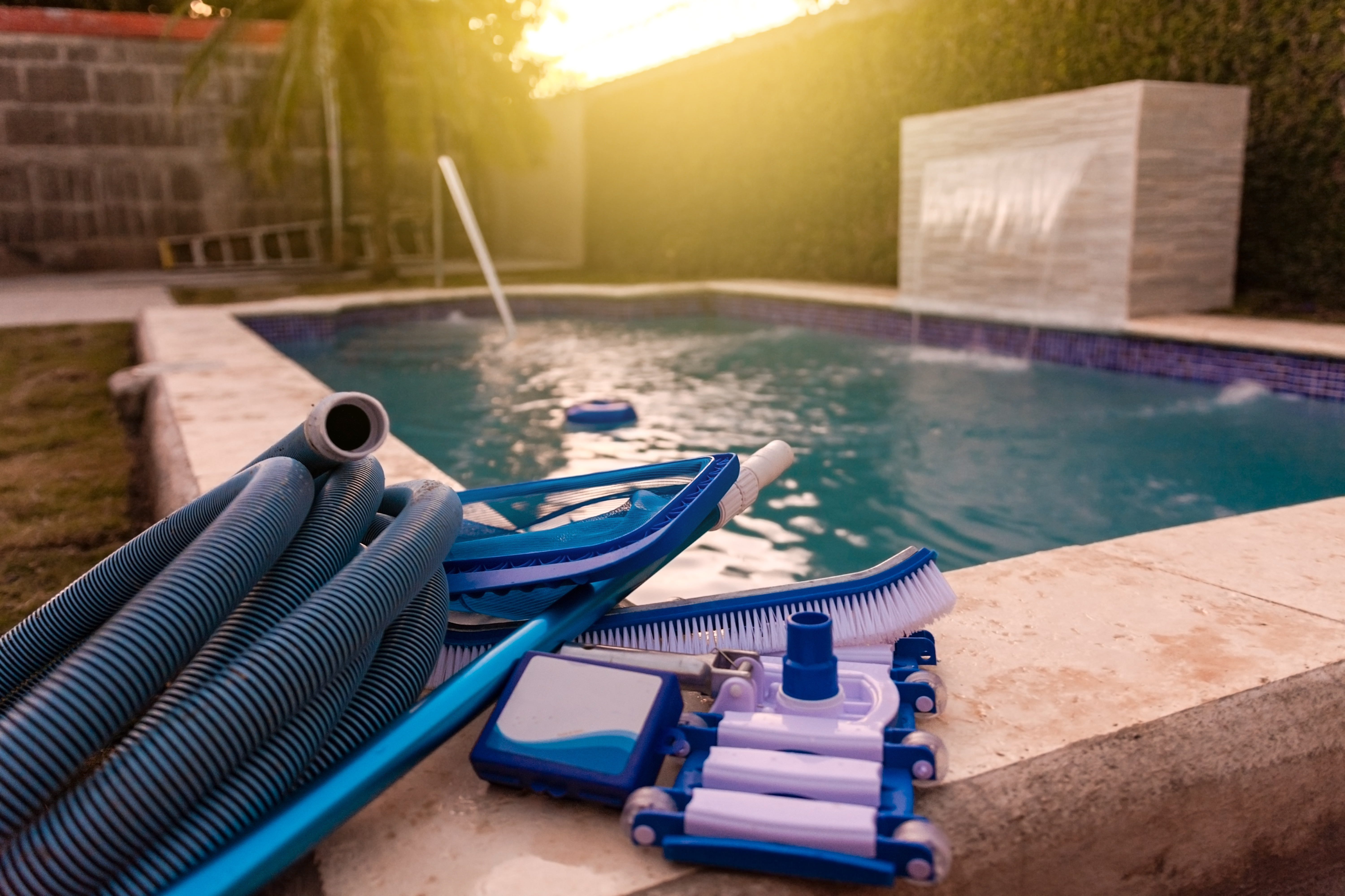 Pool maintenance equipment at sunset
